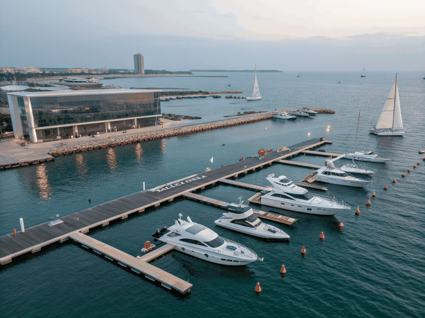 Clean modern marina with sailing and motor yachts moored at docks